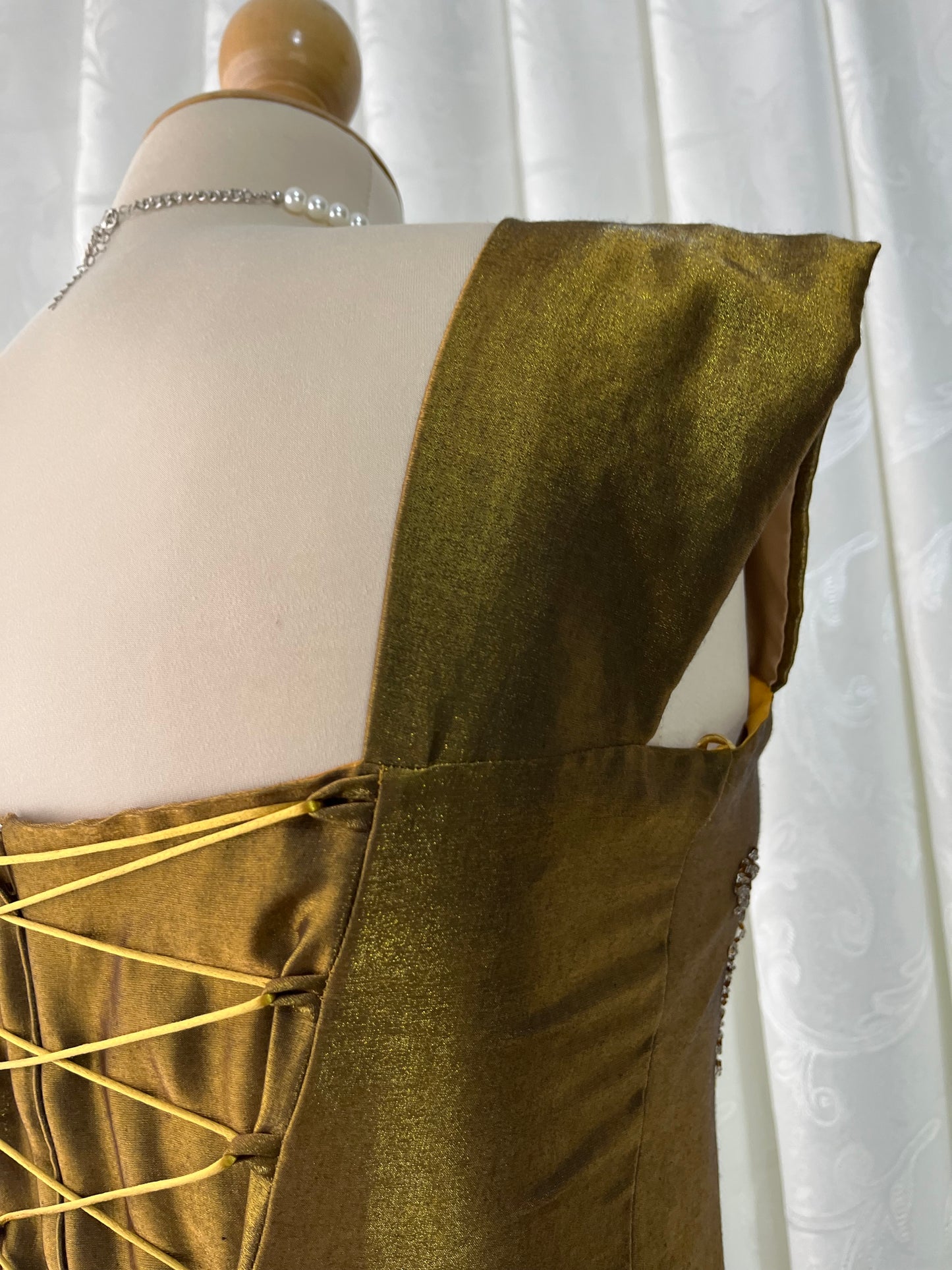 Iridescent brooch dress with fine bead embroidery