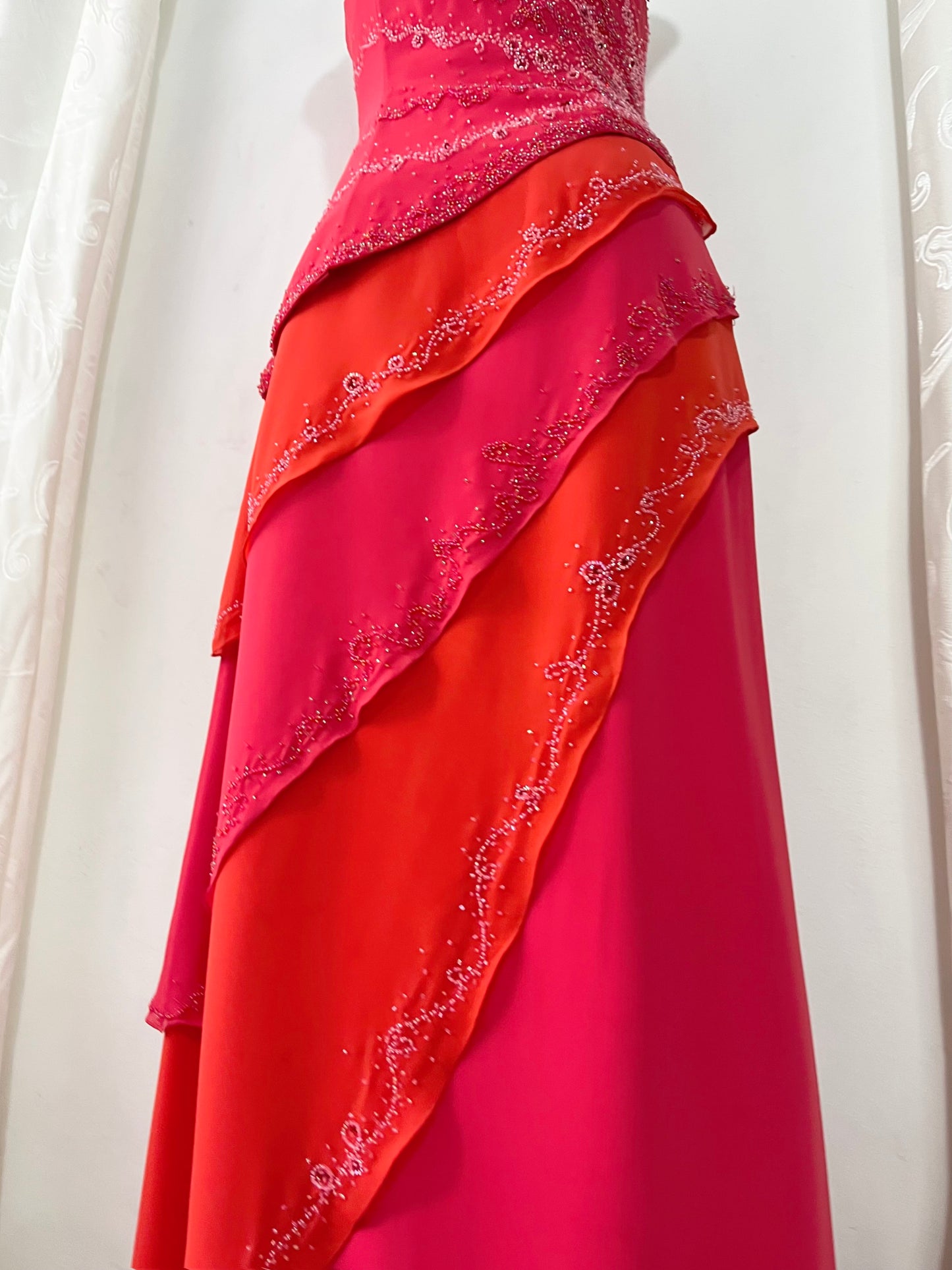 Asymmetrical raspberry and coral dress with exquisite handmade raised floral embroidery