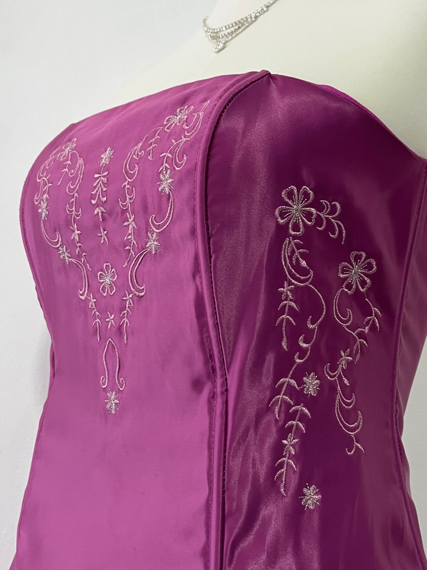 Magenta corset dress with floral designs embroidered in lilac and silver thread