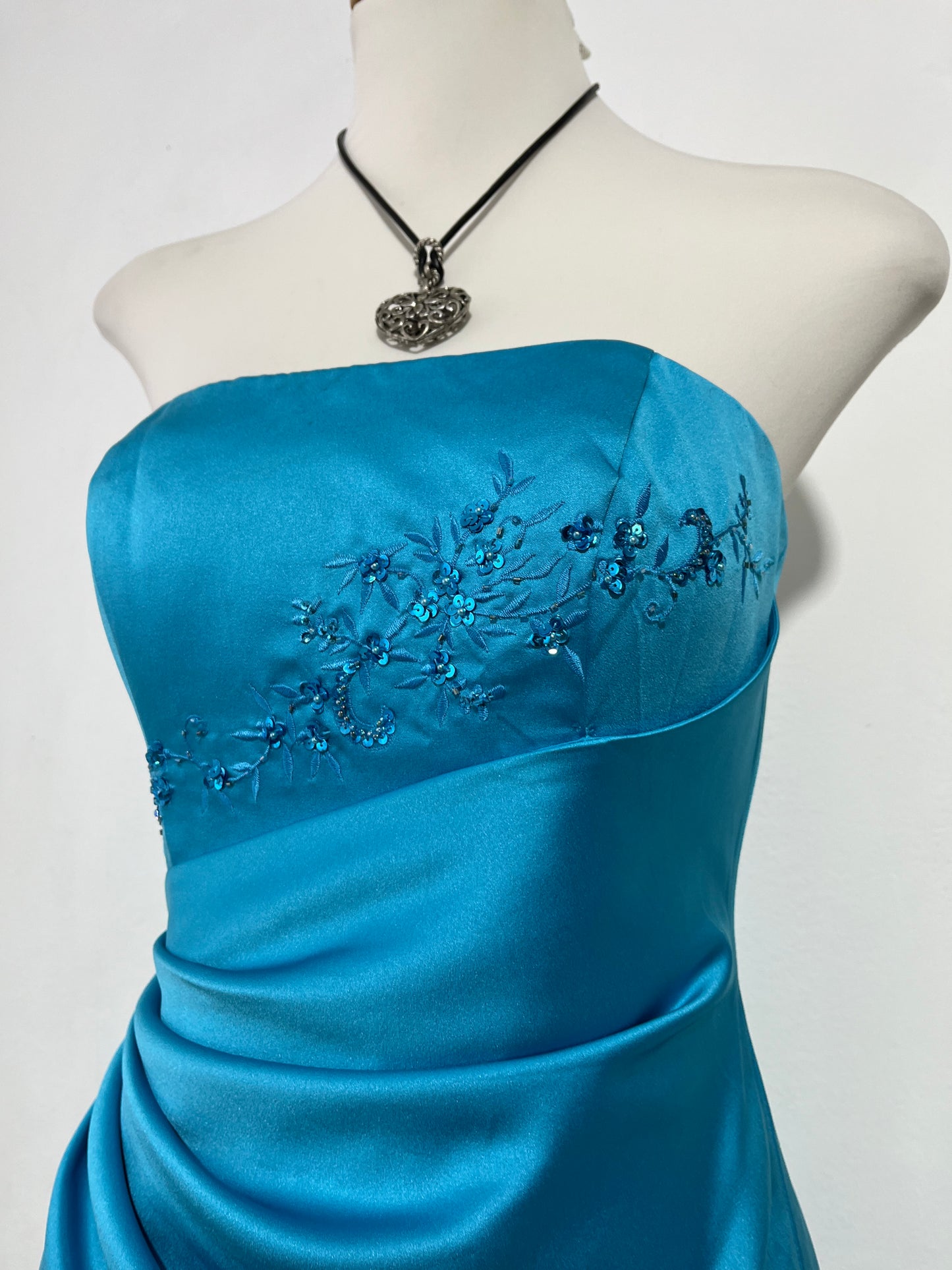 Turquoise sweetheart neckline gala gown with floral embellishments and asymmetric draped detail - size M