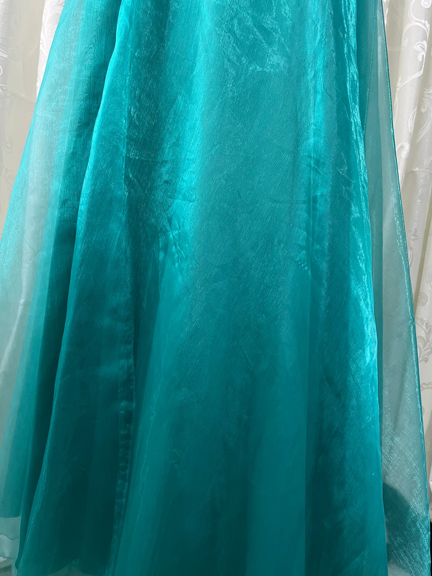 Turquoise dress with sequined waistband and matchinf cape