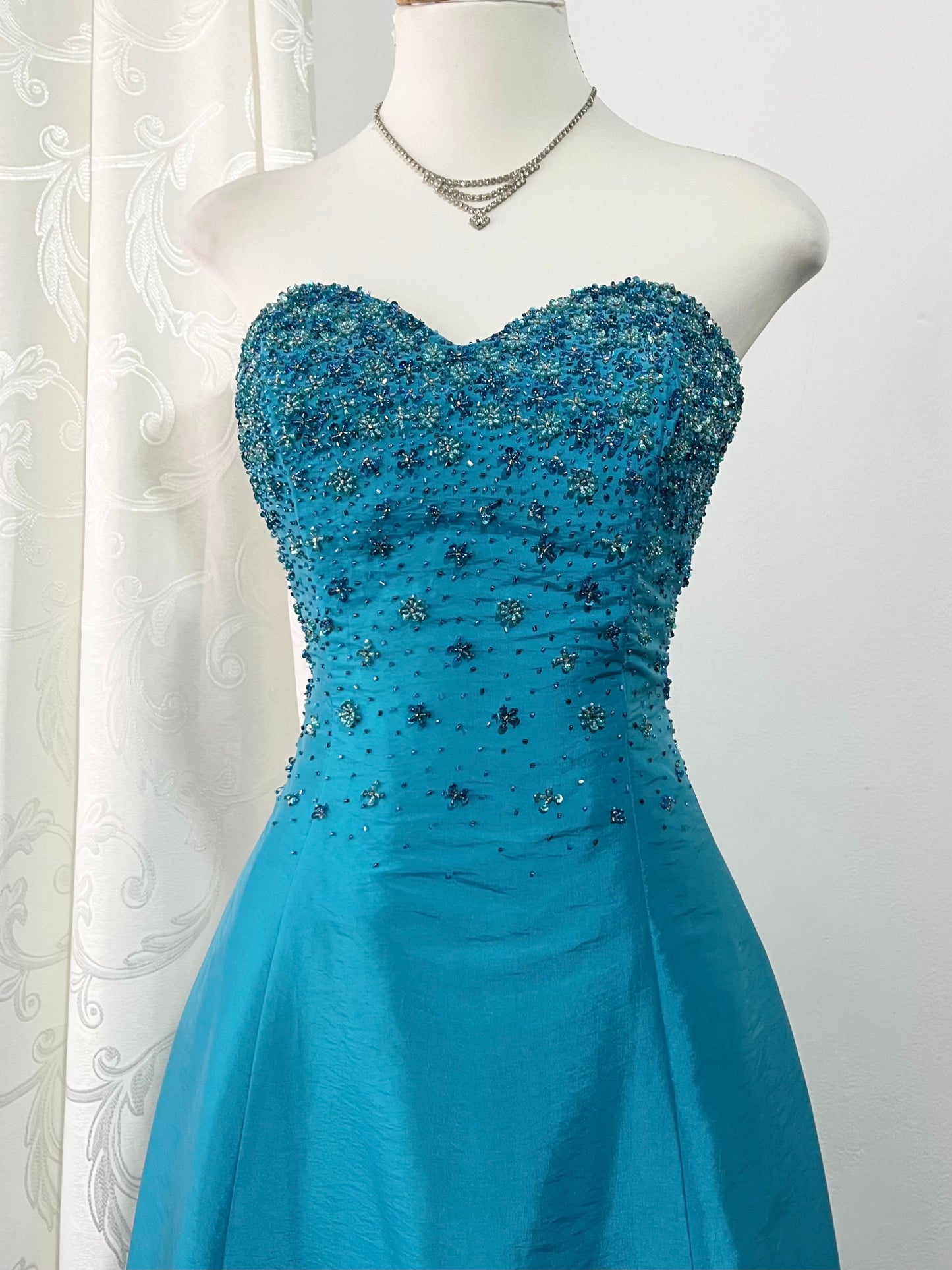 Corset evening dress in a vibrant turquoise color with exquisite handmade floral embroidery- size S