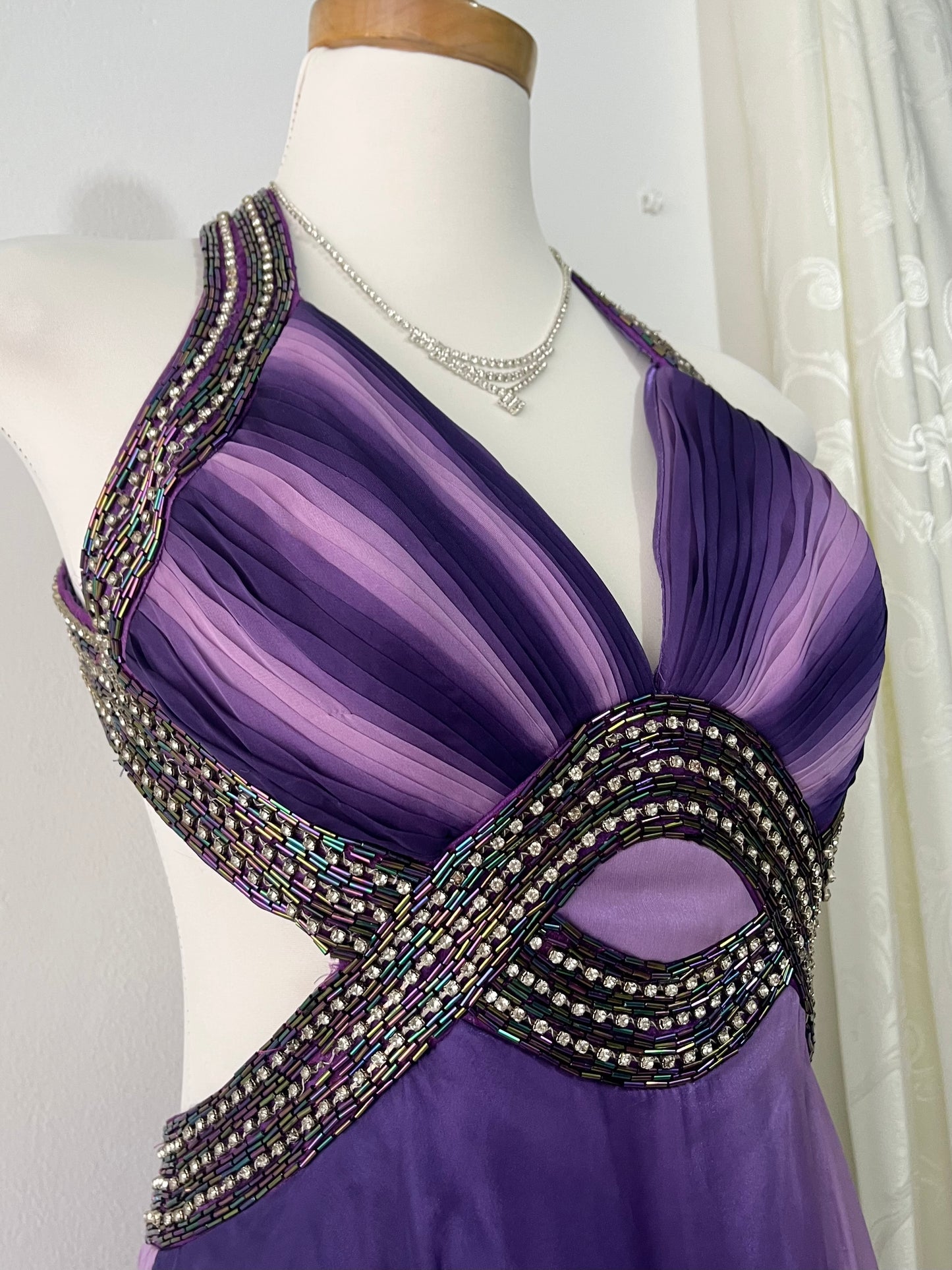 Gown in purple gradient chiffon with rhinestone appliqués at the waist and neckline
