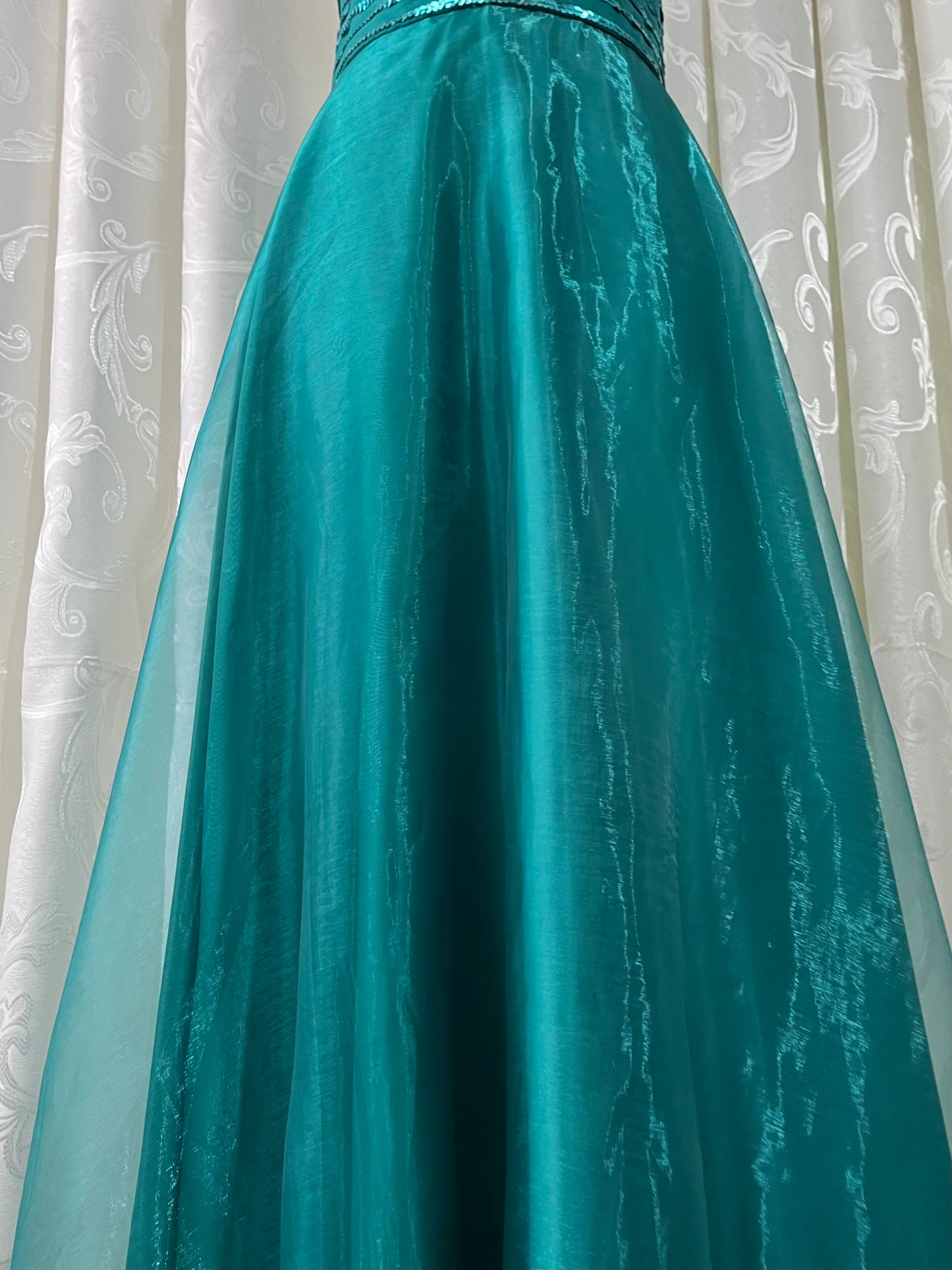 Turquoise dress with sequined waistband and matchinf cape