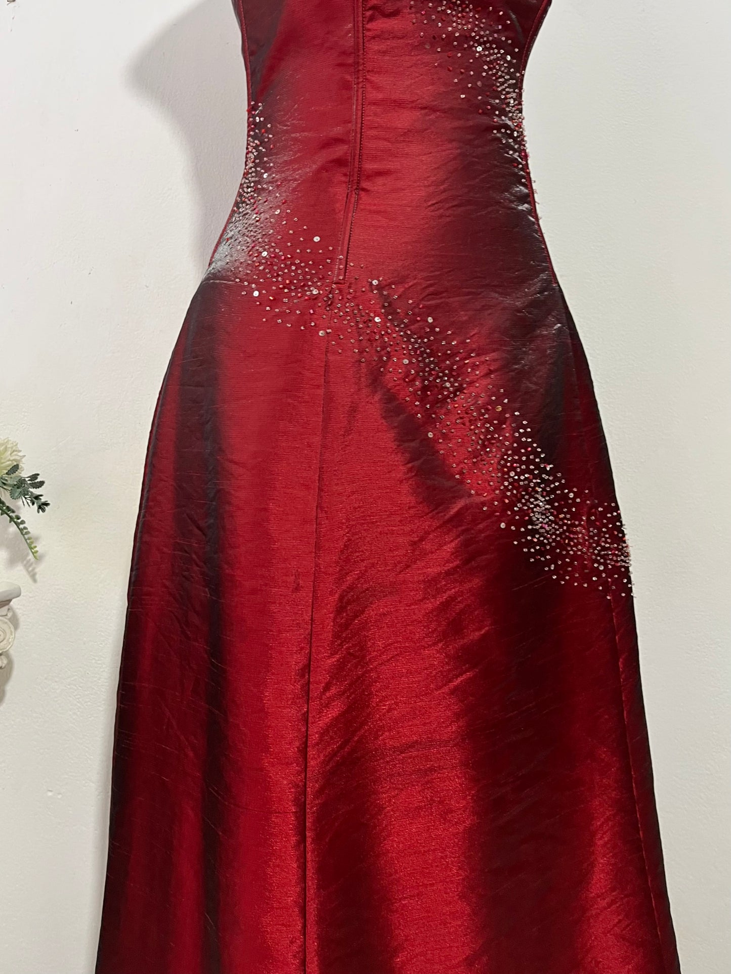 Strapless corset dress in crimson burgundy taffeta with hand-embroidered rhinestones and embellishments
