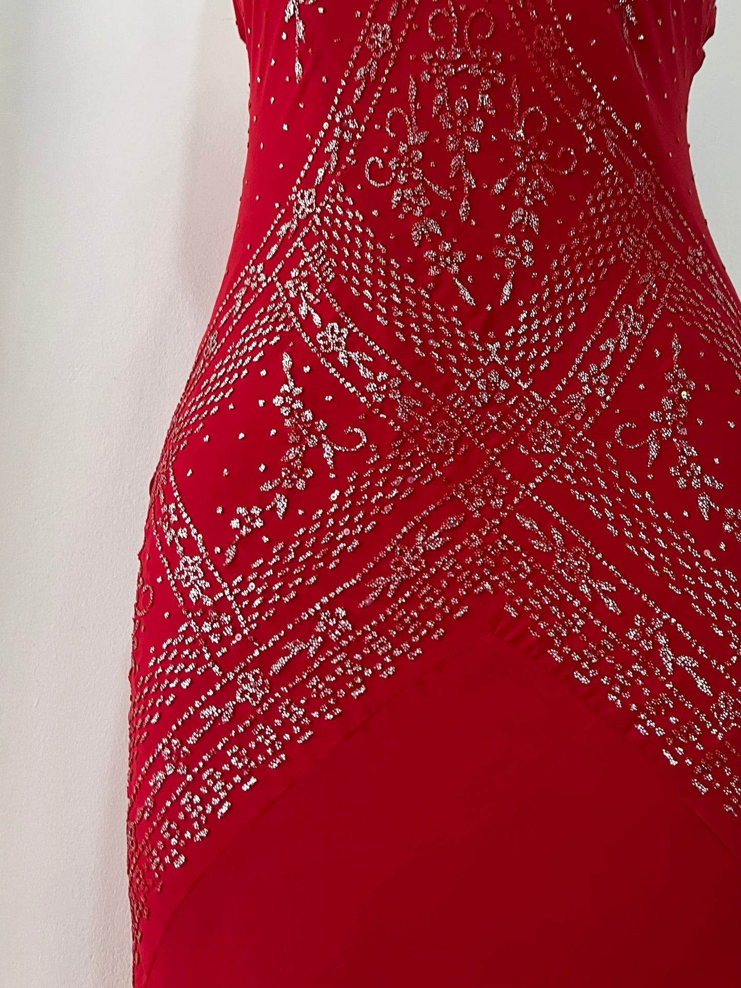 Crimson red ball gown with silver embellishments