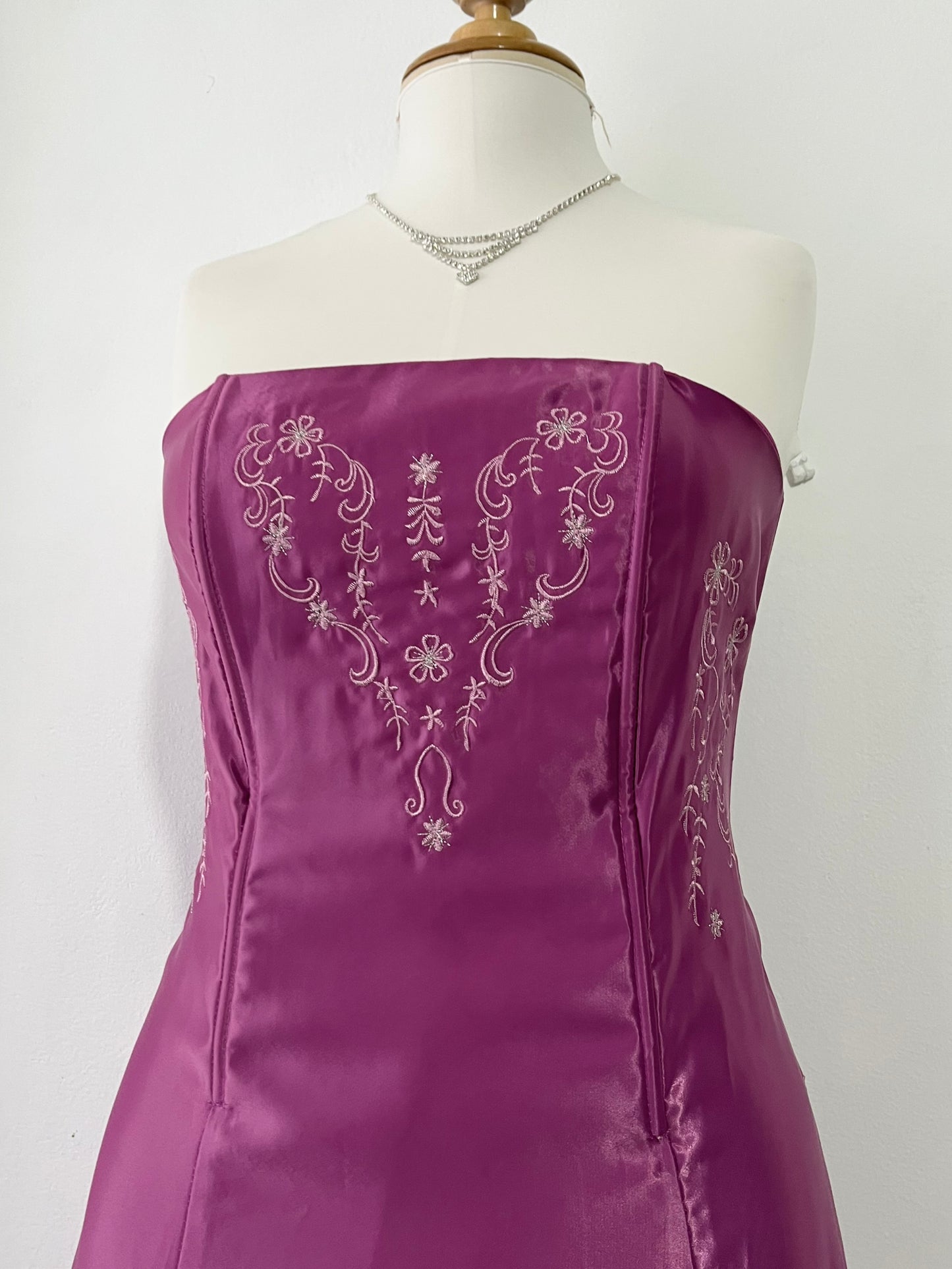 Magenta corset dress with floral designs embroidered in lilac and silver thread