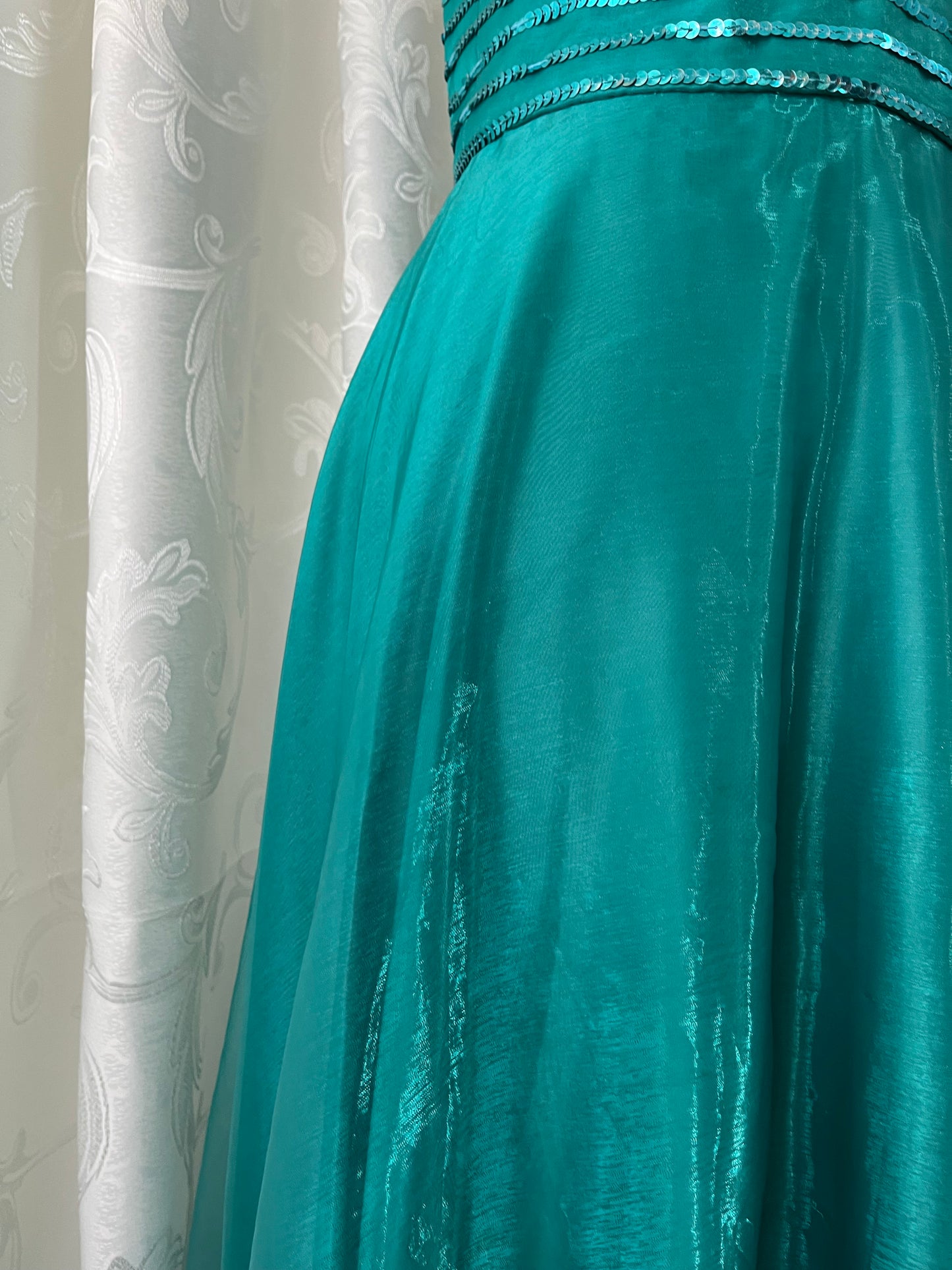 Turquoise dress with sequined waistband and matchinf cape