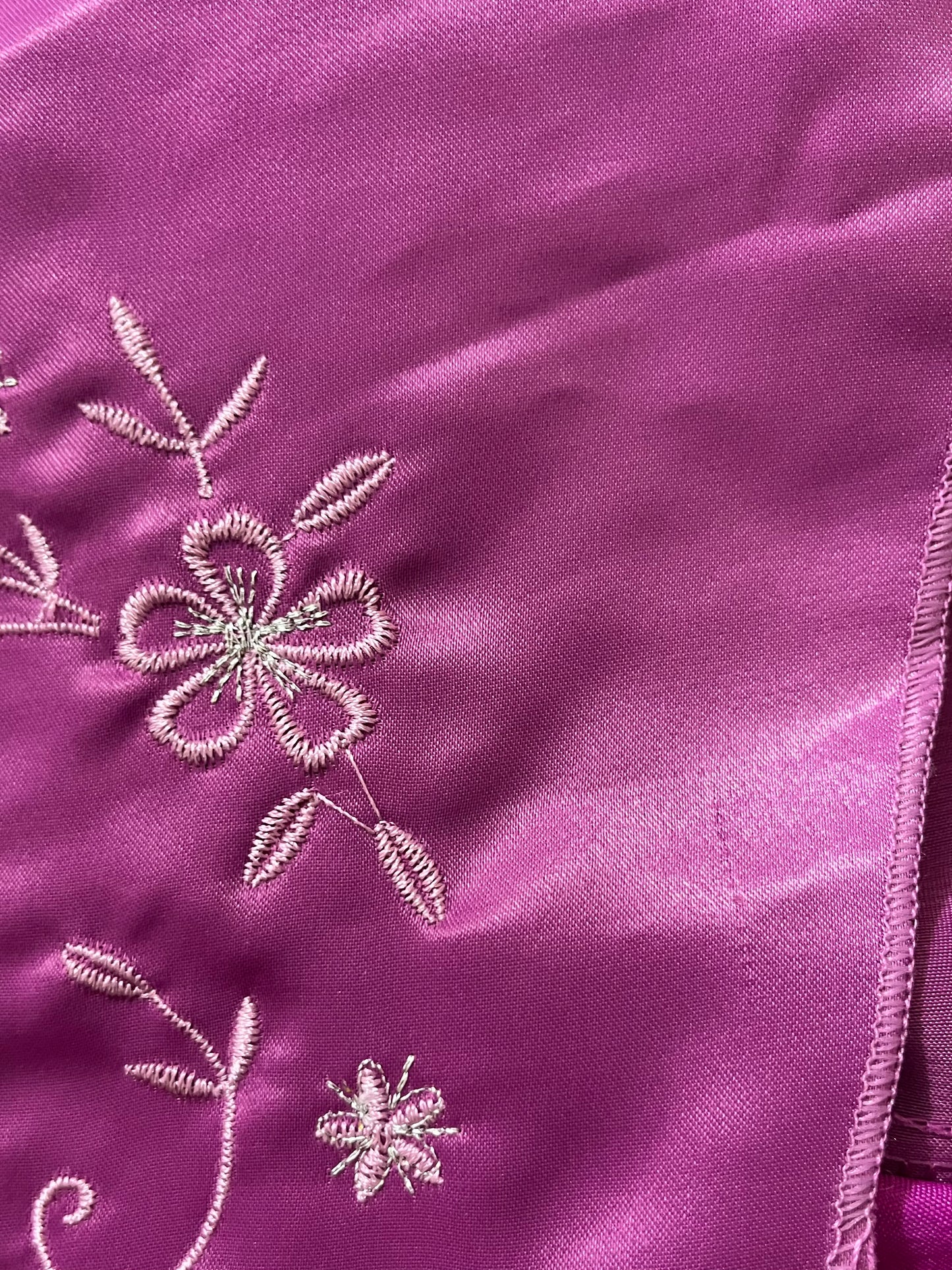 Magenta corset dress with floral designs embroidered in lilac and silver thread