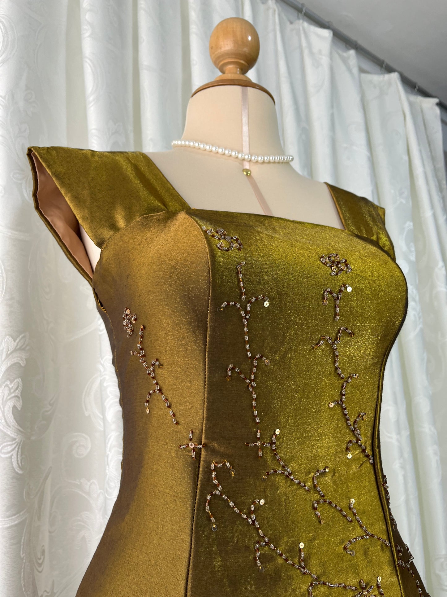 Iridescent brooch dress with fine bead embroidery