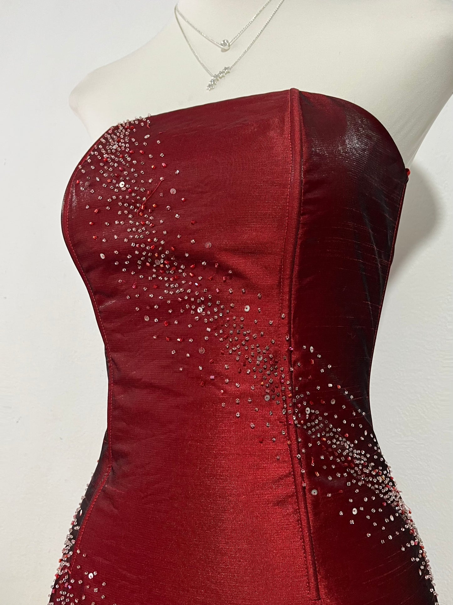 Strapless corset dress in crimson burgundy taffeta with hand-embroidered rhinestones and embellishments