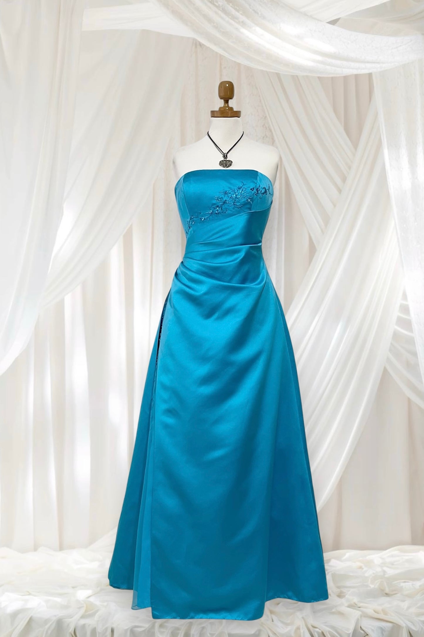 Turquoise sweetheart neckline gala gown with floral embellishments and asymmetric draped detail - size M