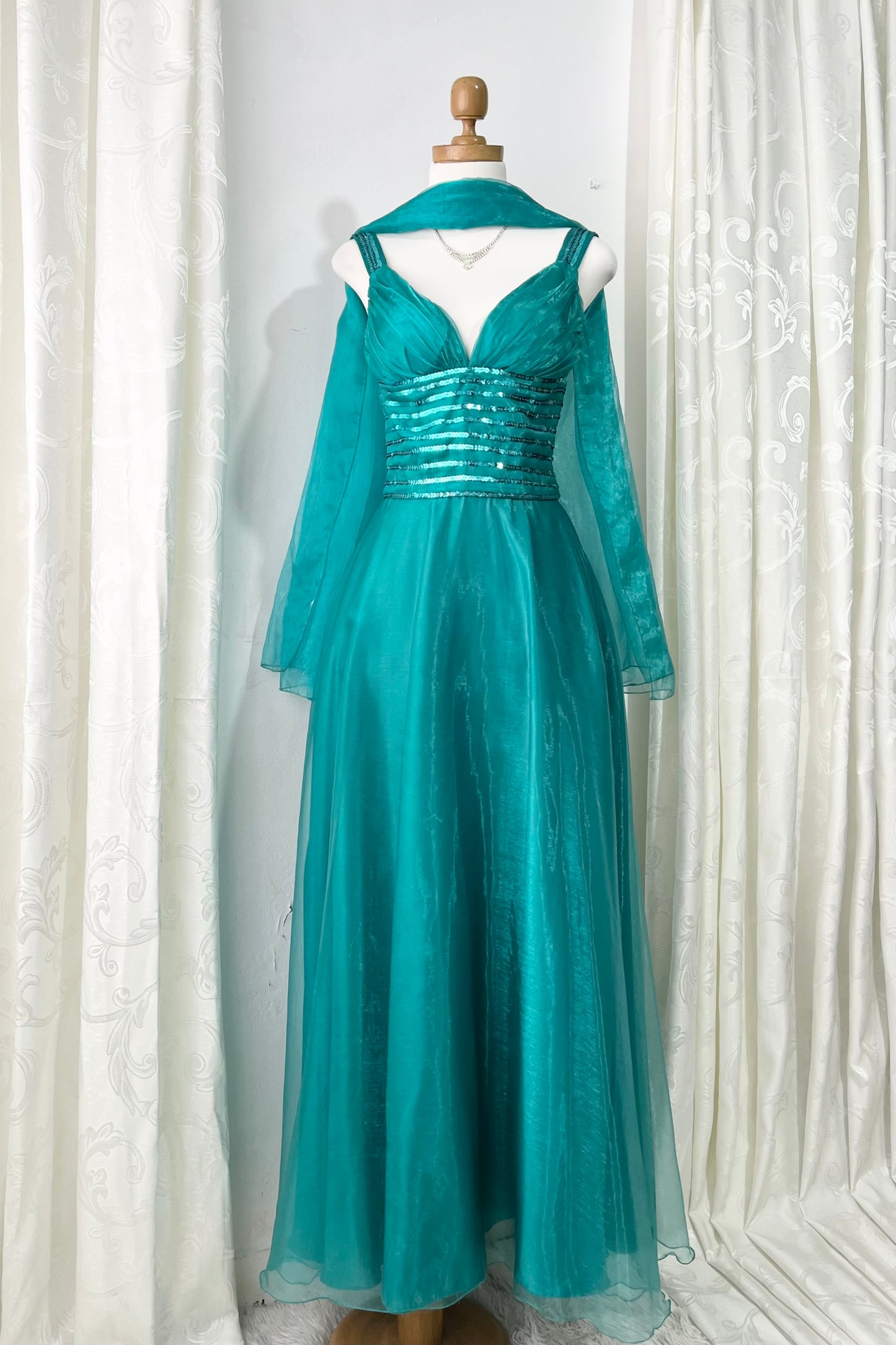 Turquoise dress with sequined waistband and matchinf cape