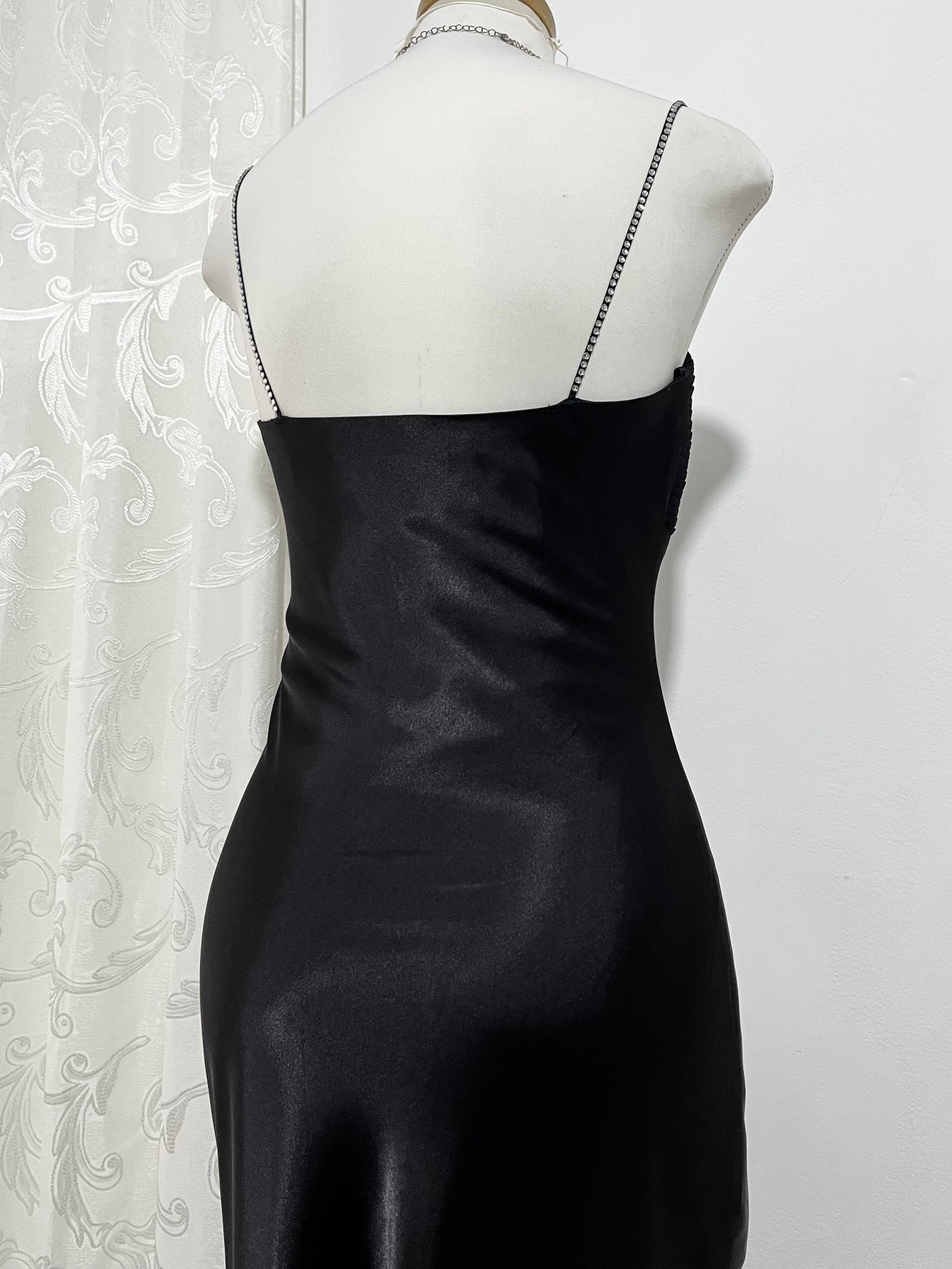 Noir silk satin dress with silver appliqués