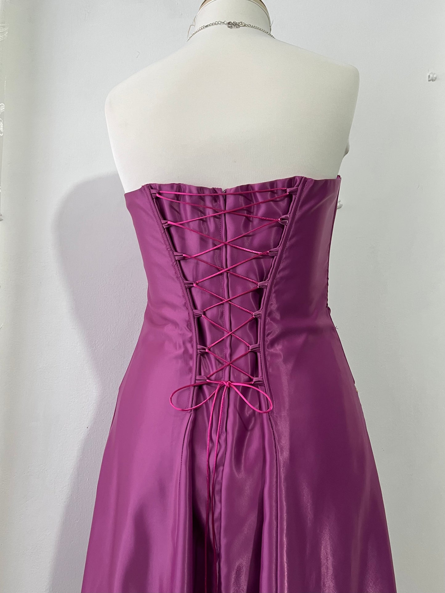 Magenta corset dress with floral designs embroidered in lilac and silver thread