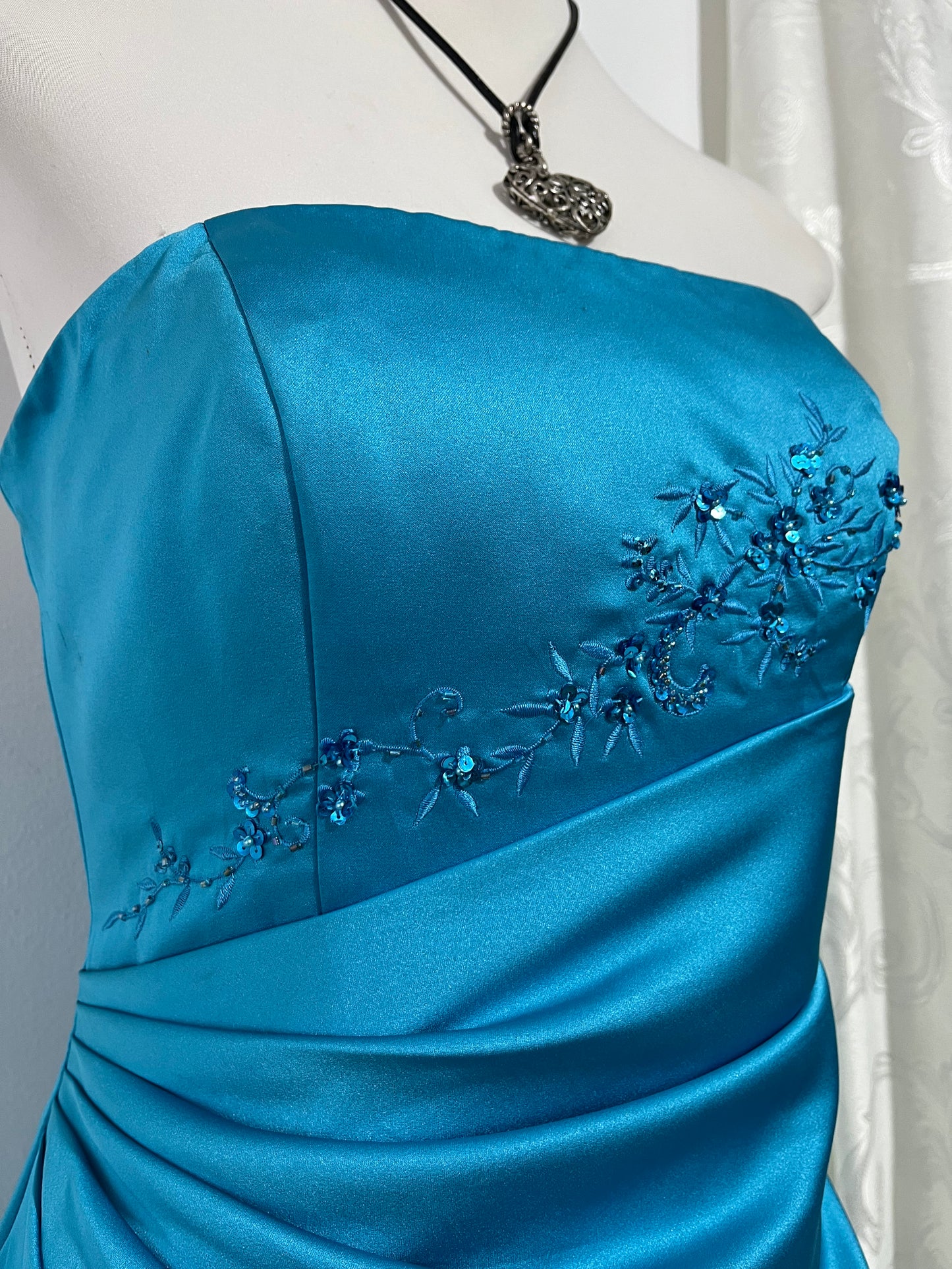 Turquoise sweetheart neckline gala gown with floral embellishments and asymmetric draped detail - size M