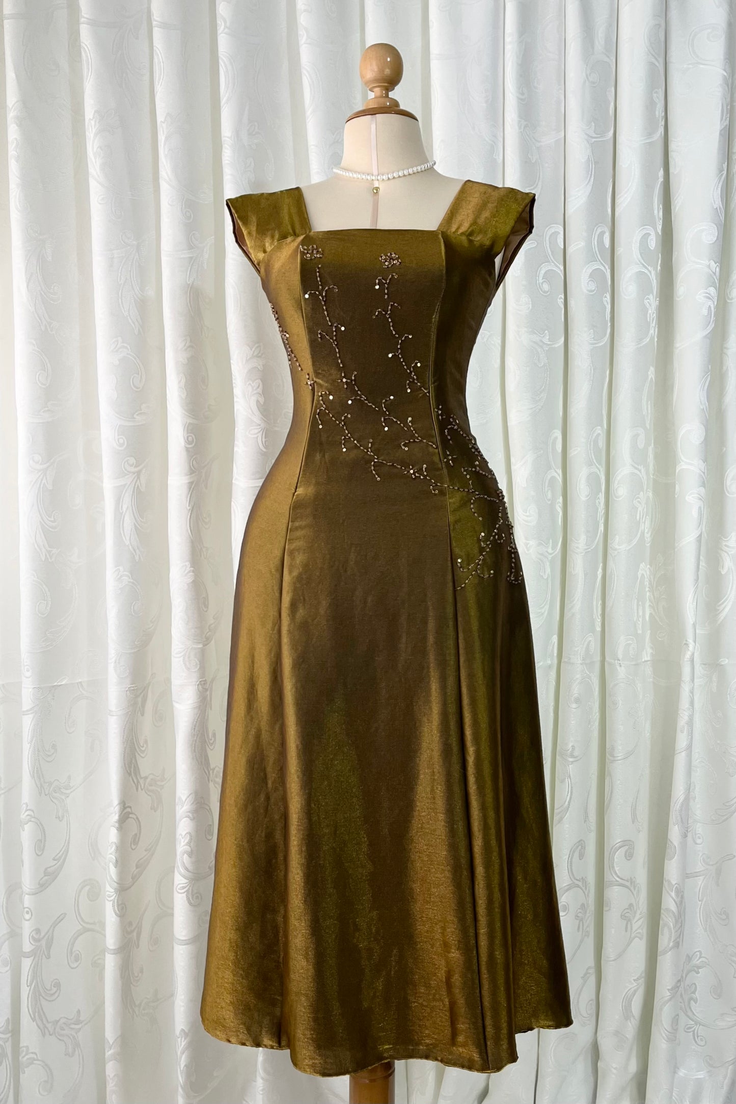 Iridescent brooch dress with fine bead embroidery