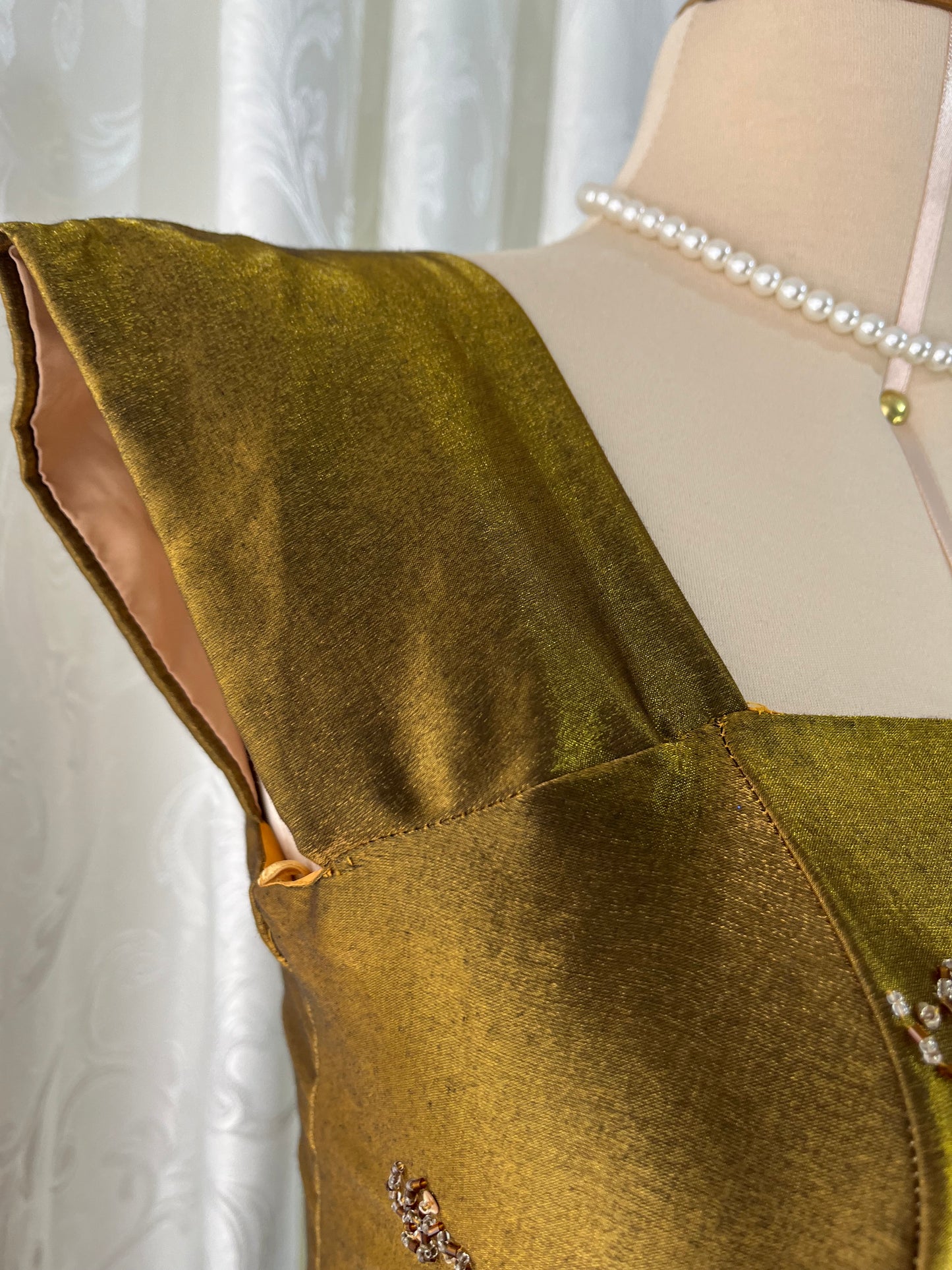 Iridescent brooch dress with fine bead embroidery