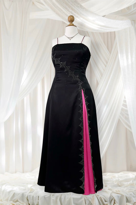 Noir corset dress with fuchsia side slit, sequin details and hand-embroidered embellishments