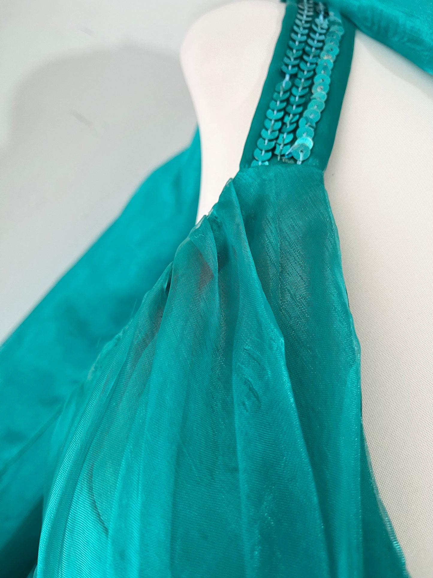 Turquoise dress with sequined waistband and matchinf cape