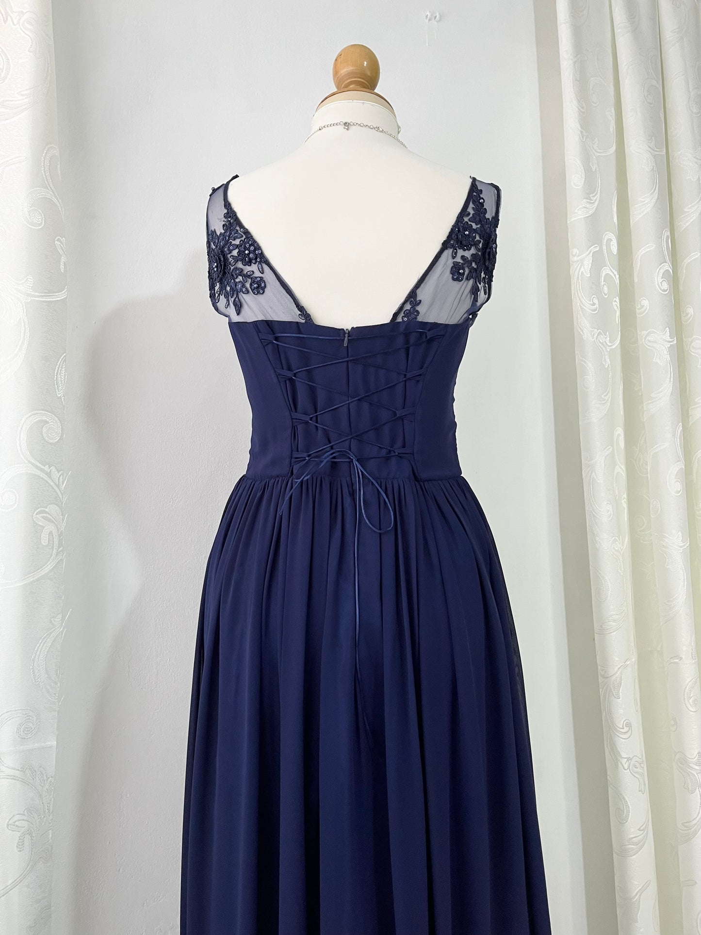 Captivating blue dress with embroidered floral designs and pearls on the chest-Size L
