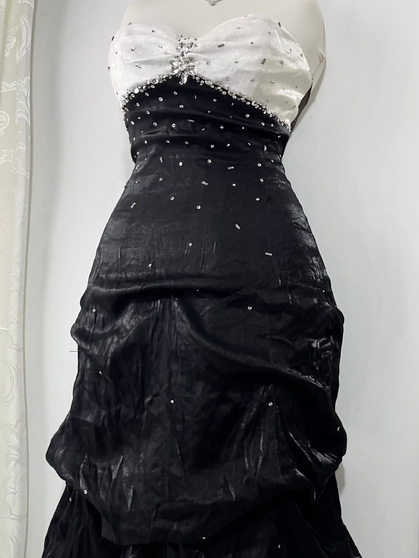 Noir and ivory gown with a skirt featuring gathered details, rhinestone appliqués, and sparkling embellishments.- size M/L
