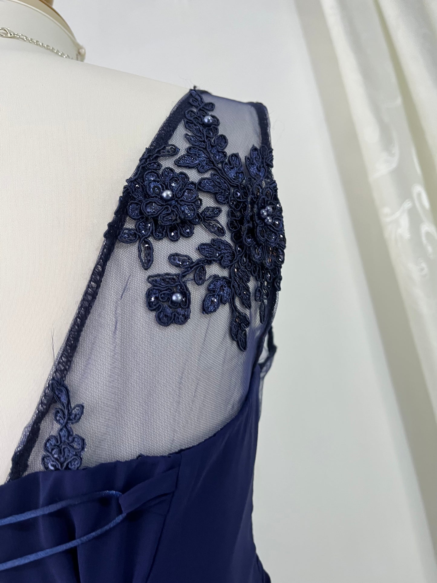 Captivating blue dress with embroidered floral designs and pearls on the chest-Size L
