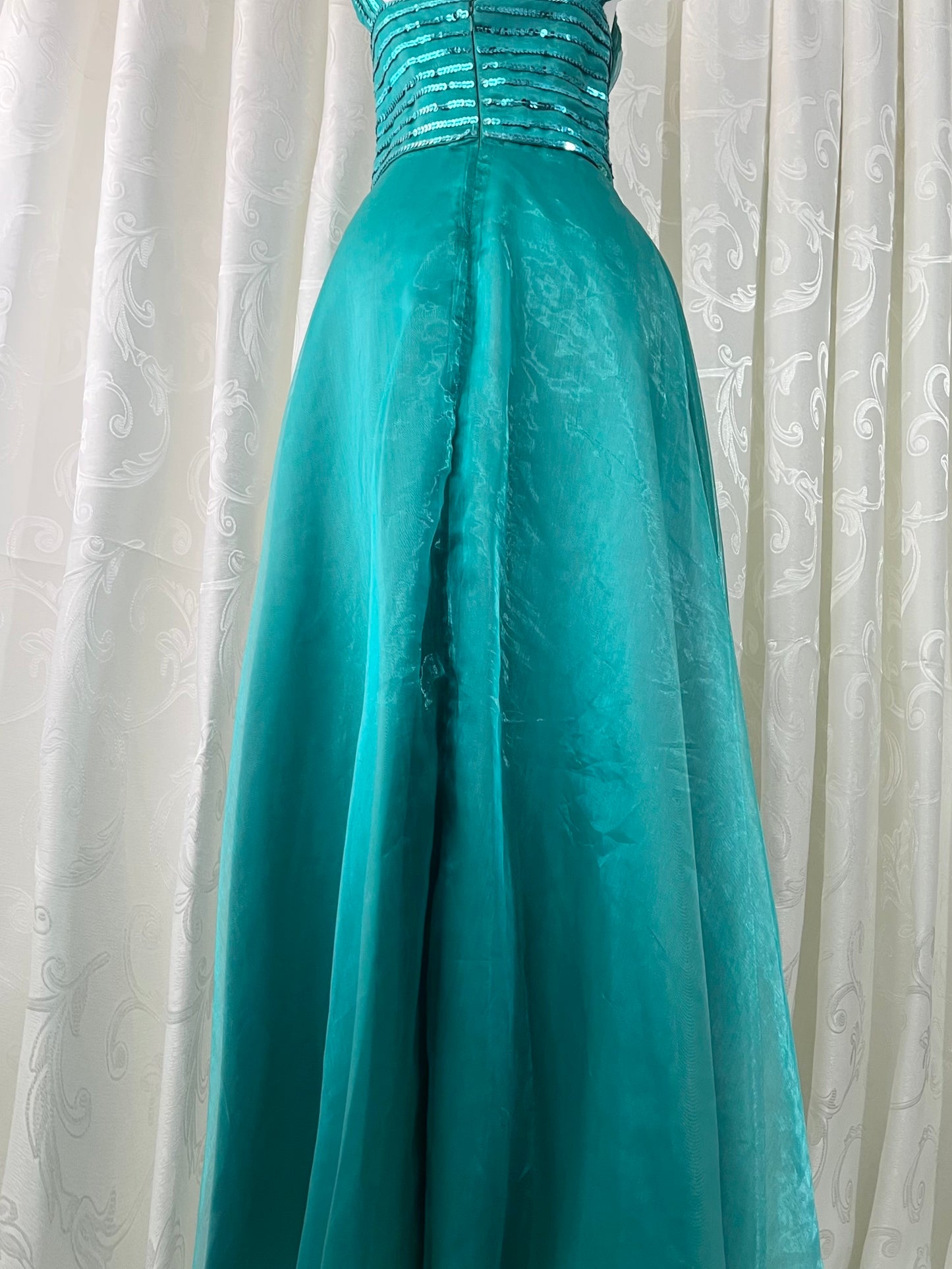 Turquoise dress with sequined waistband and matchinf cape