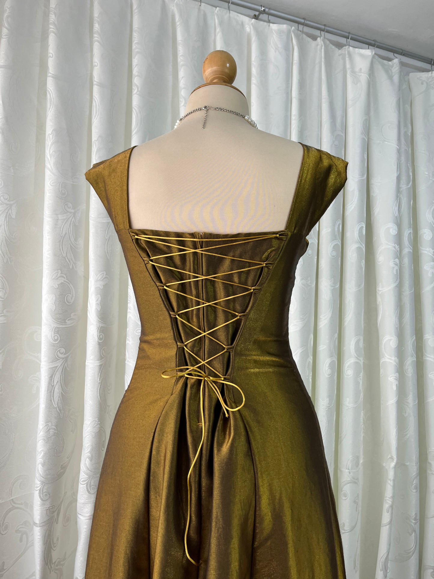 Iridescent brooch dress with fine bead embroidery