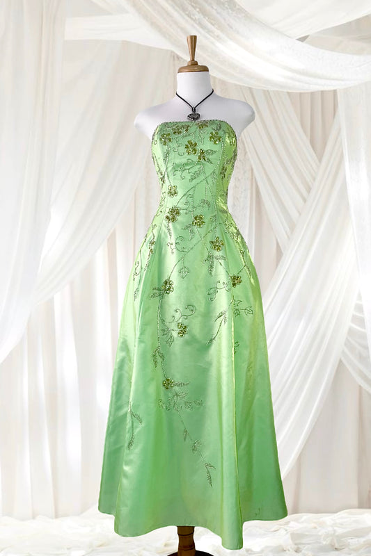 Corset gown dress in a vibrant pistachio green with exquisite handmade raised floral embroidery