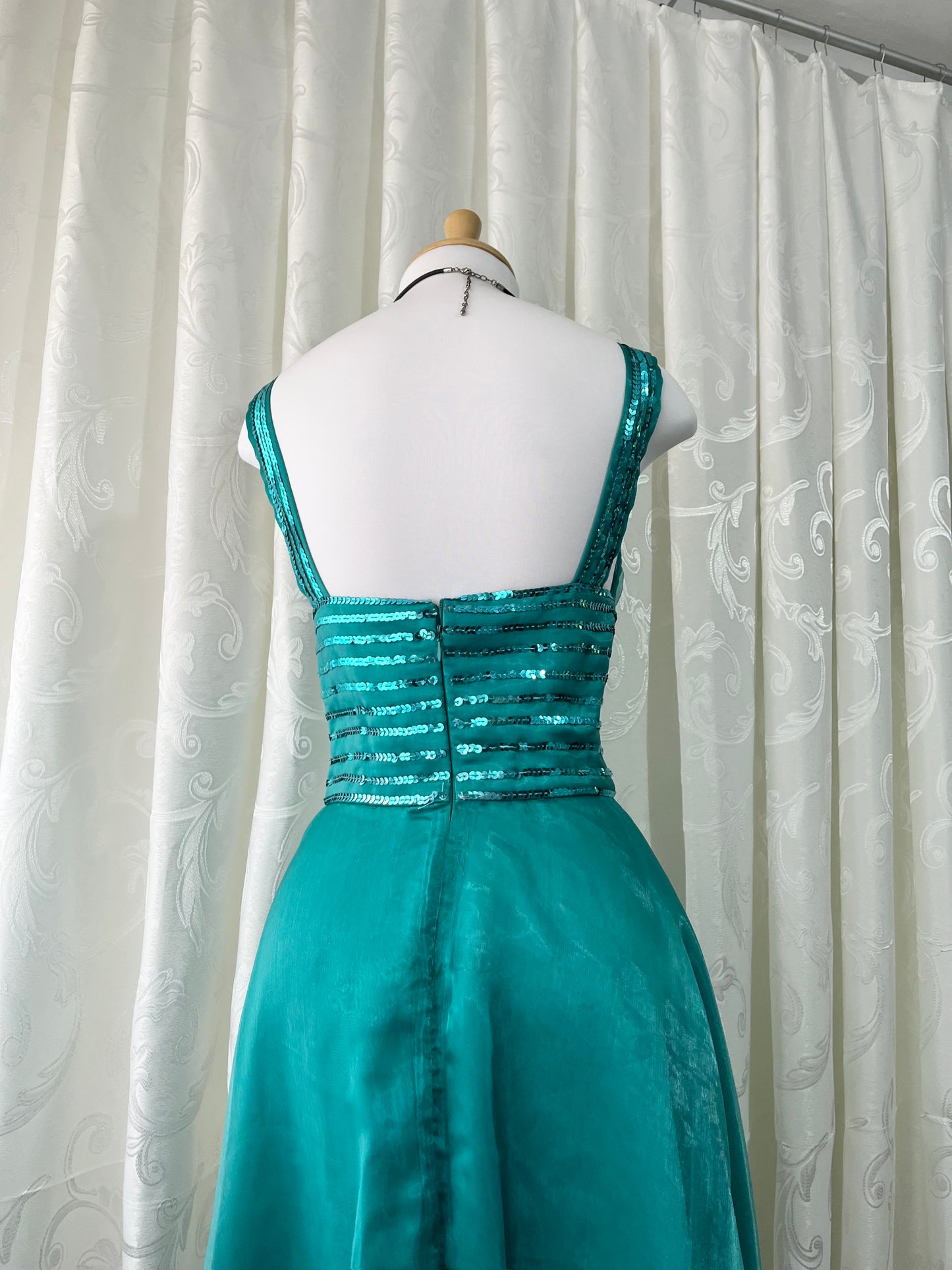 Turquoise dress with sequined waistband and matchinf cape
