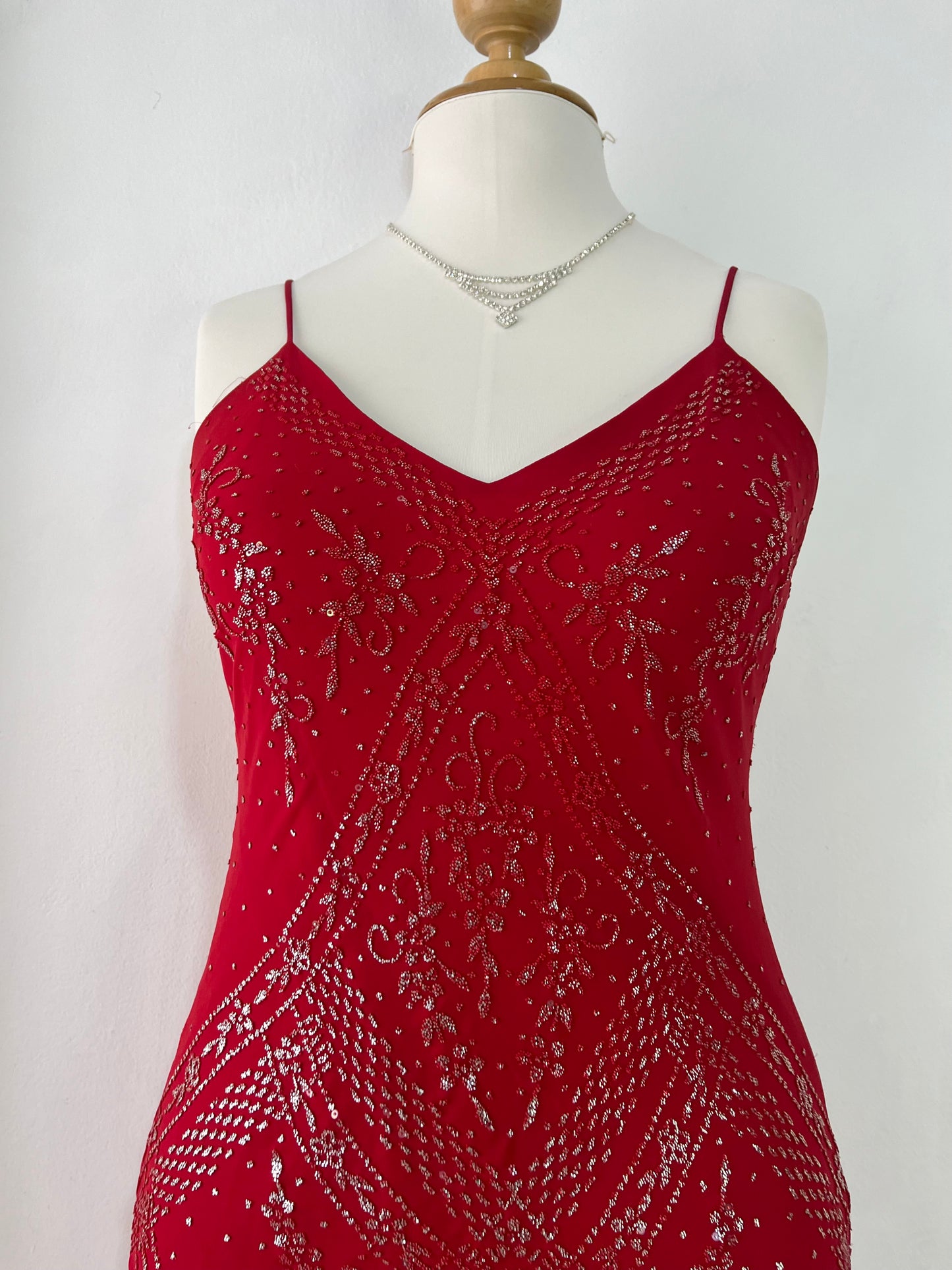Crimson red ball gown with silver embellishments