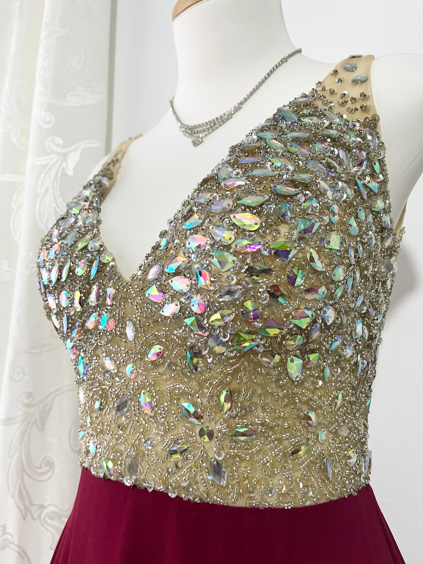 Evening gown with a bodice exquisitely hand-decorated with rhinestones and embellishments