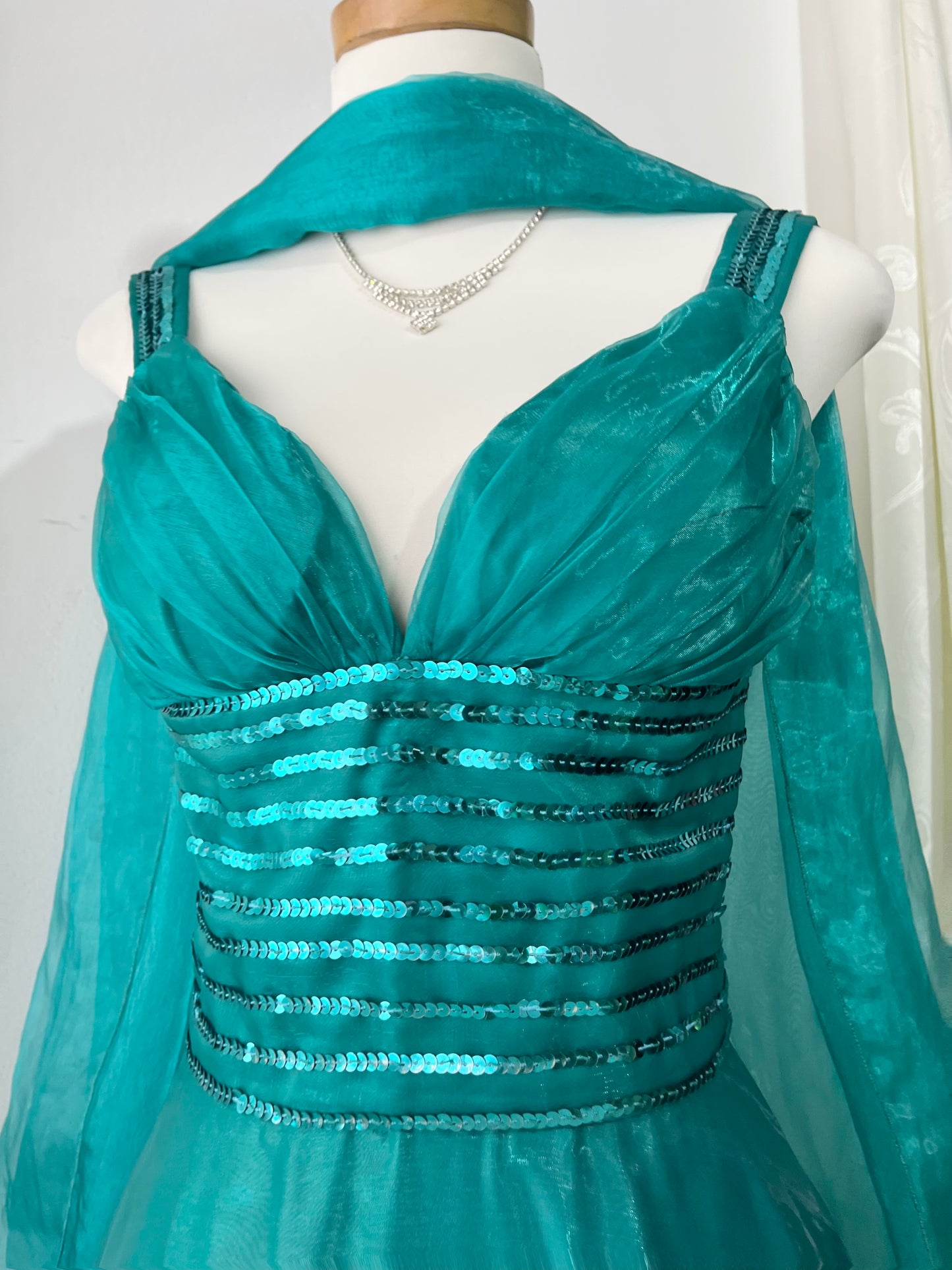 Turquoise dress with sequined waistband and matchinf cape