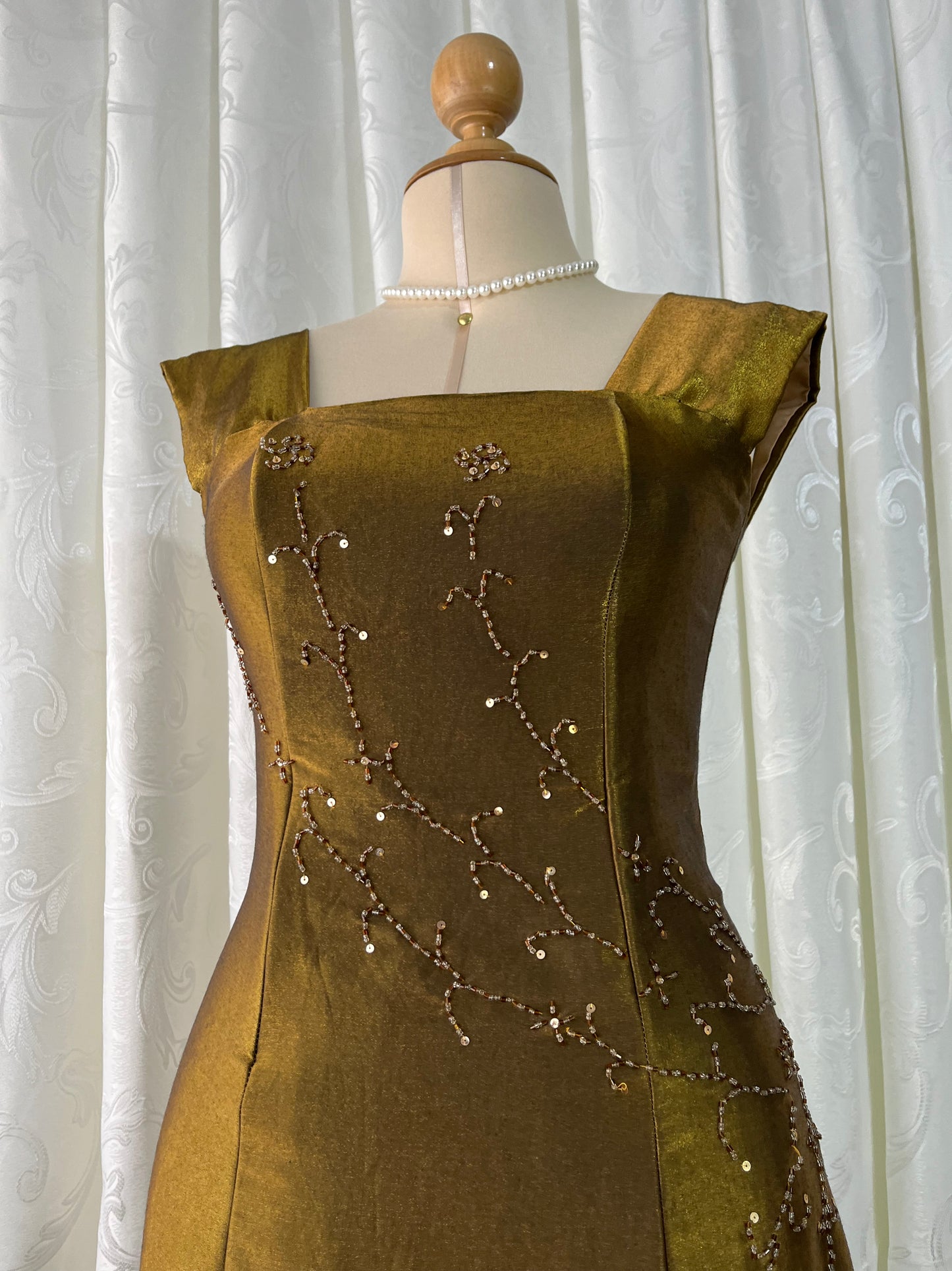 Iridescent brooch dress with fine bead embroidery