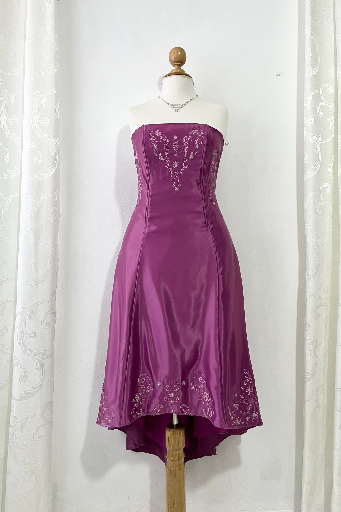 Magenta corset dress with floral designs embroidered in lilac and silver thread
