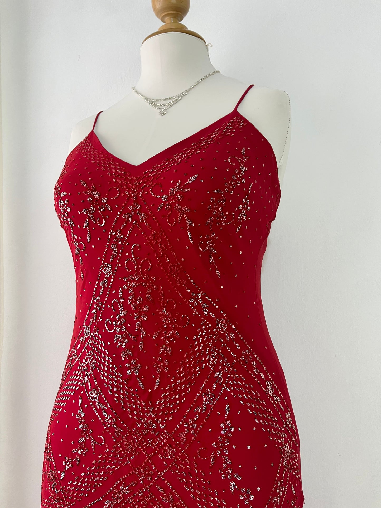 Crimson red ball gown with silver embellishments