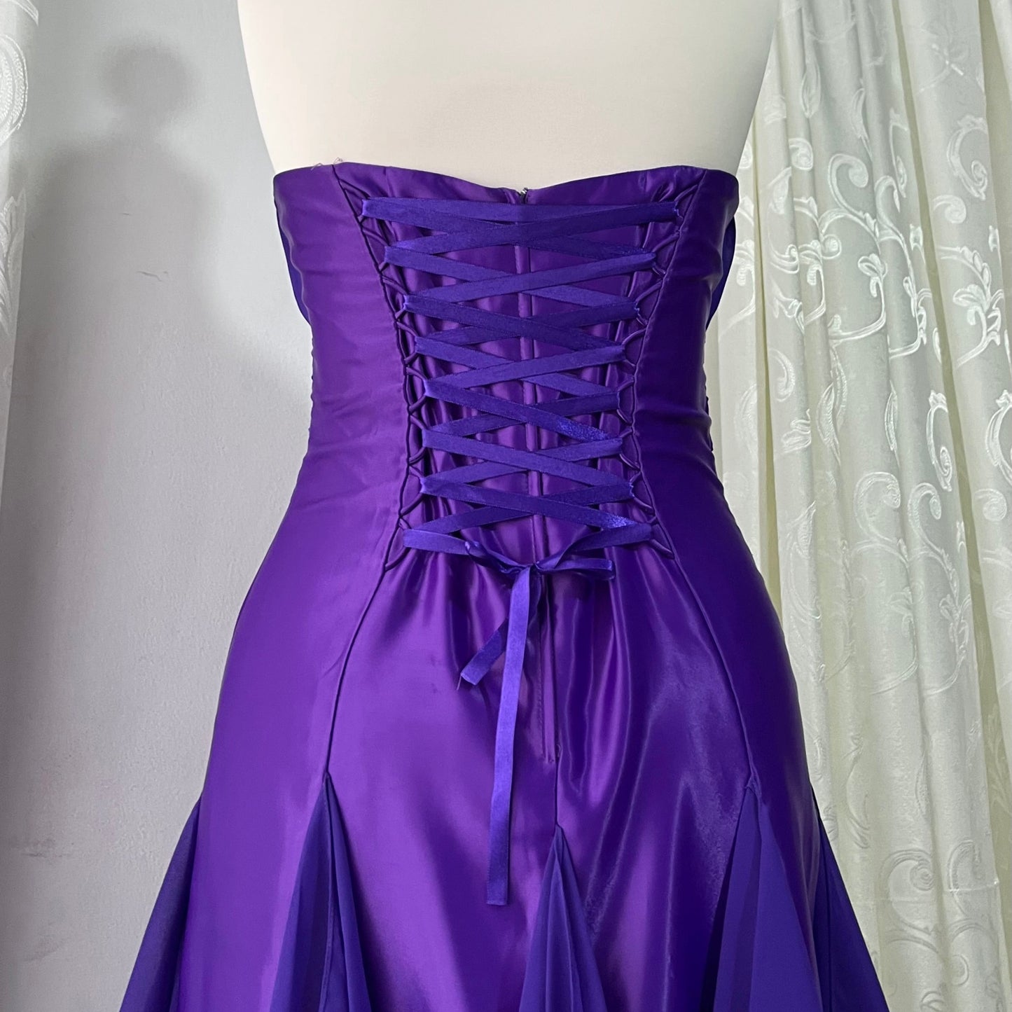 Royal purple corset gown with ruffles
