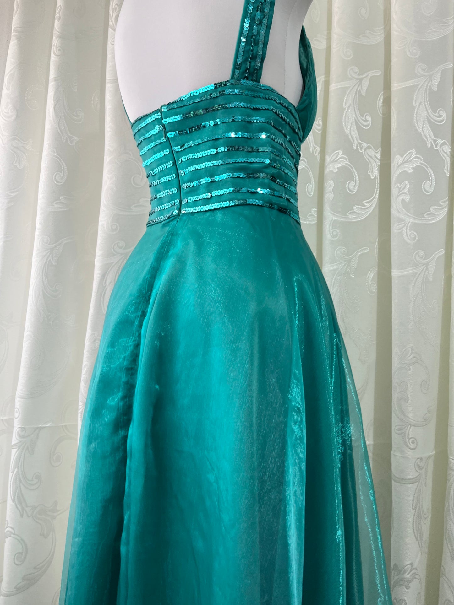 Turquoise dress with sequined waistband and matchinf cape