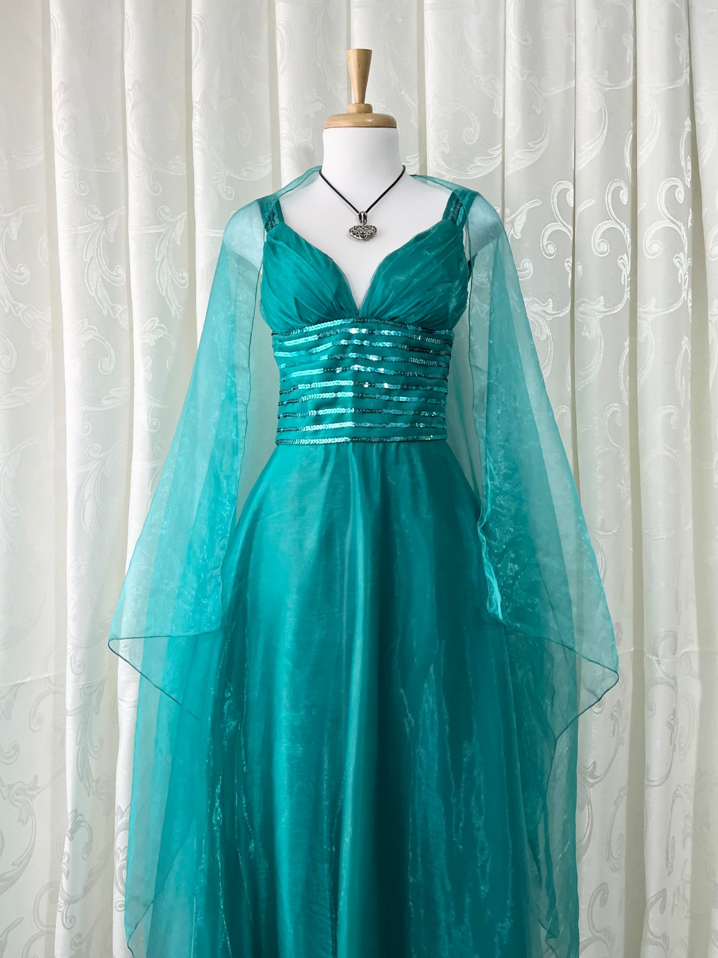 Turquoise dress with sequined waistband and matchinf cape