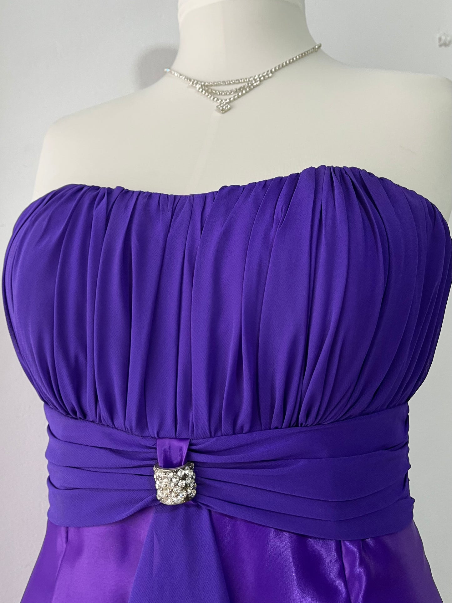Royal purple corset gown with ruffles