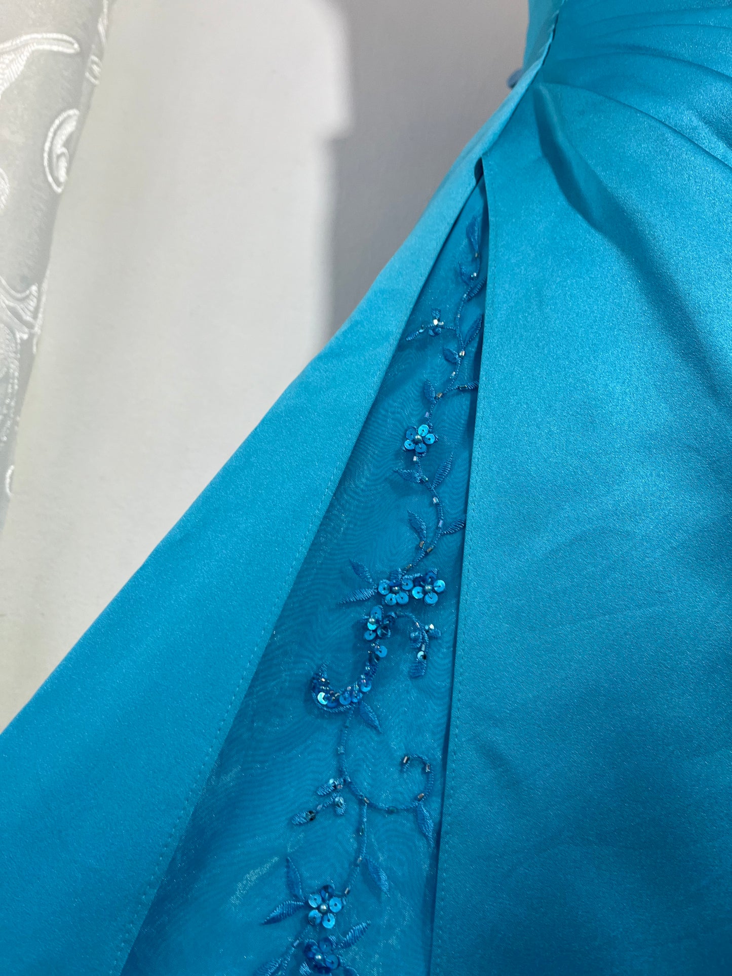 Turquoise sweetheart neckline gala gown with floral embellishments and asymmetric draped detail - size M