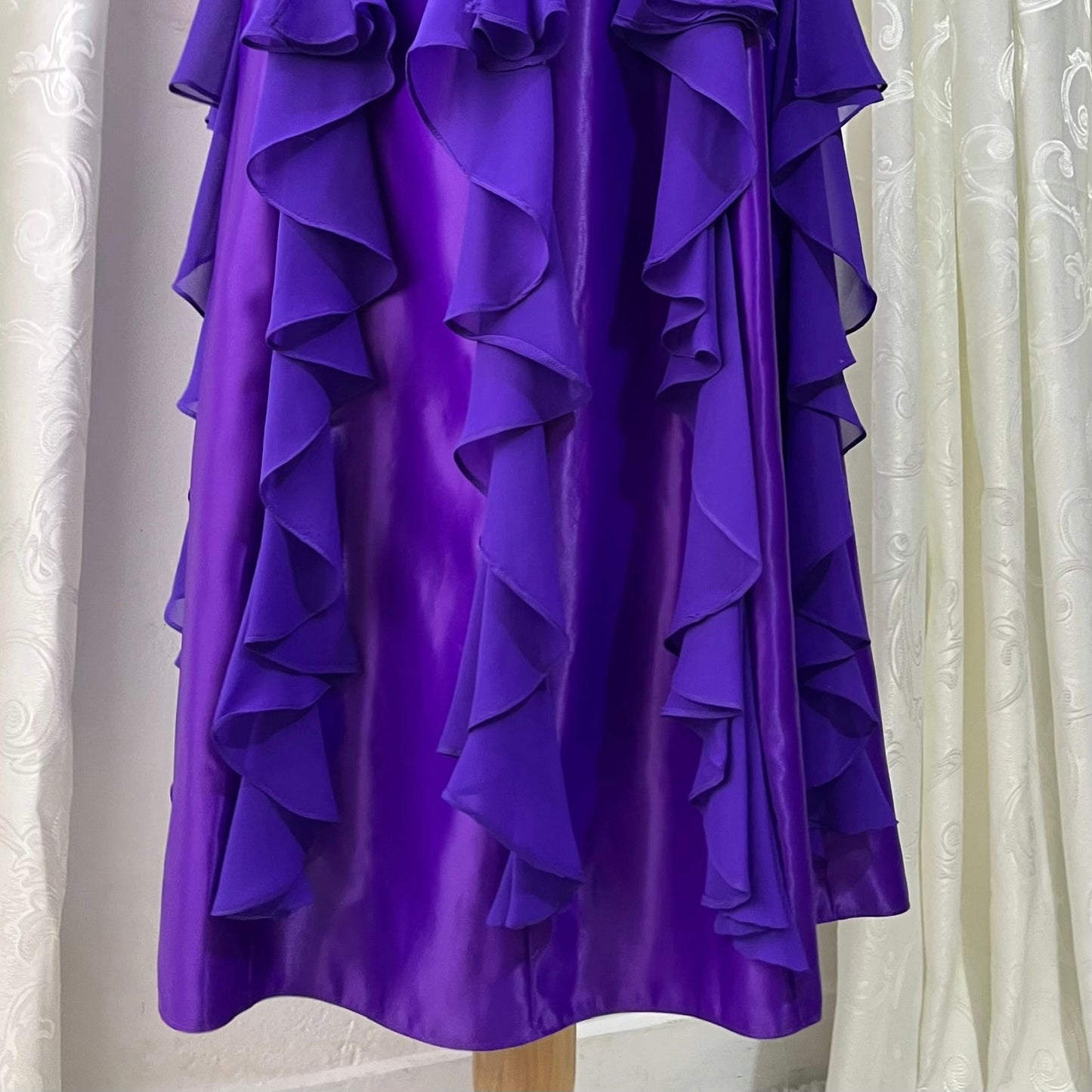Royal purple corset gown with ruffles