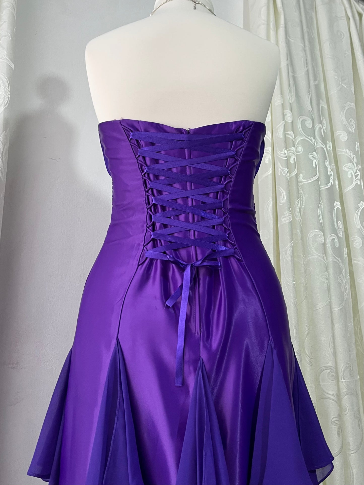 Royal purple corset gown with ruffles