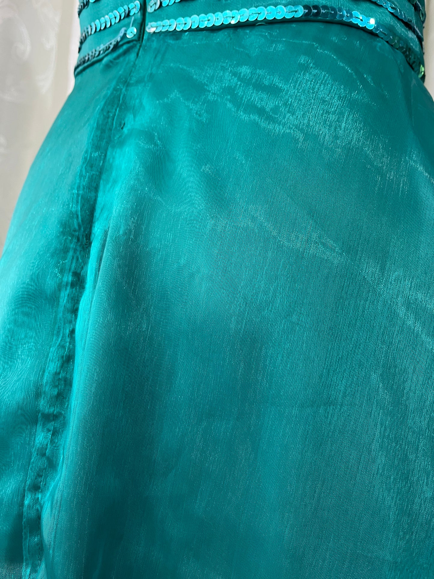 Turquoise dress with sequined waistband and matchinf cape