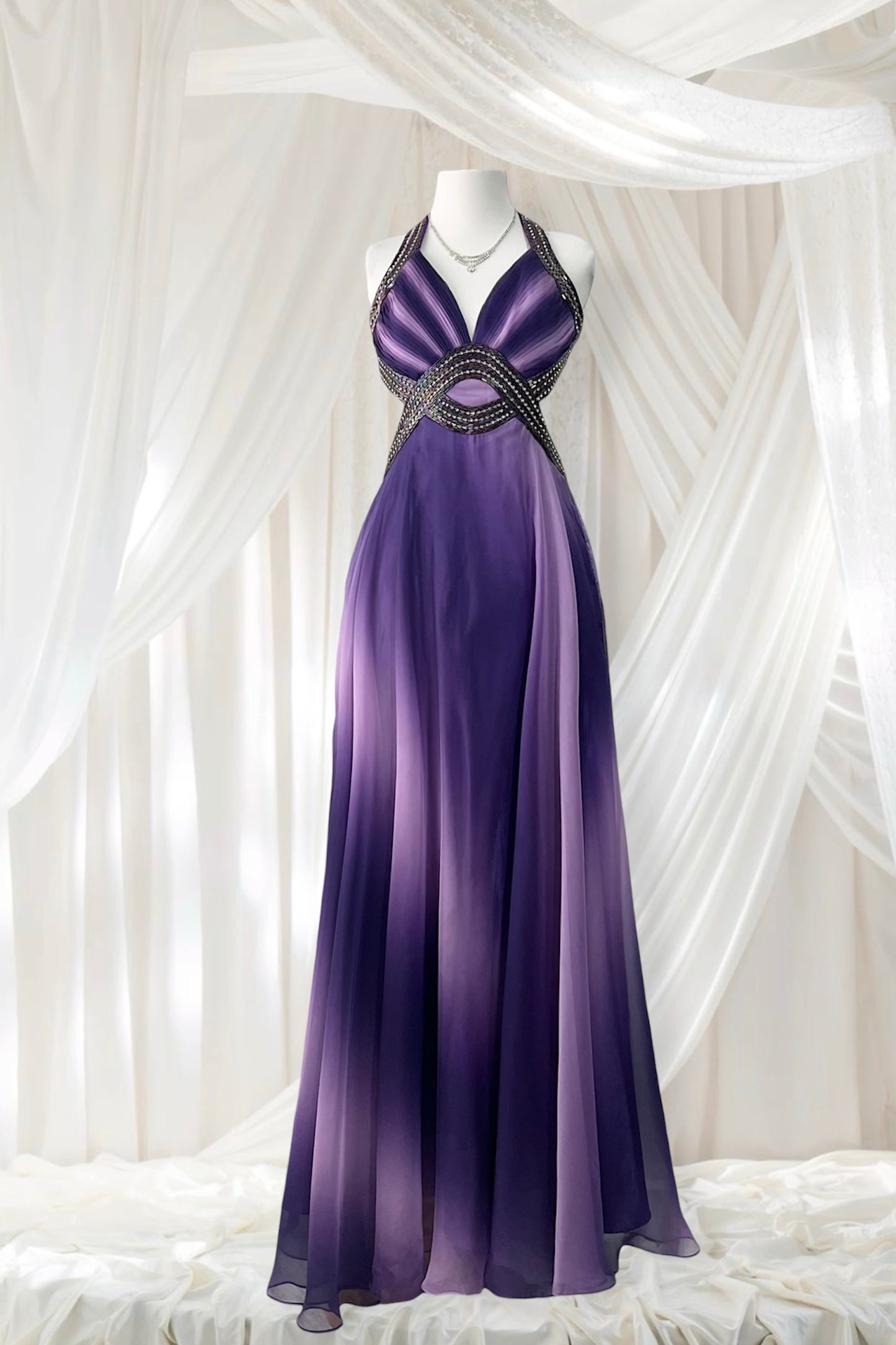 Gown in purple gradient chiffon with rhinestone appliqués at the waist and neckline